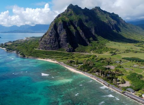 Aerial view of an island in hawaii with water surrounding