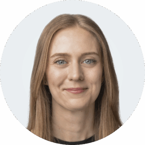 Headshot of a person in a blouse.