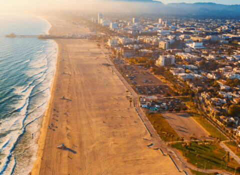 Aerial photo of a beach and cityscape in Santa Monica.